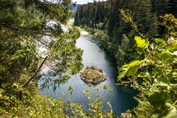 Small island on a river in the mountains