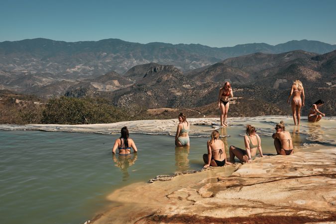 Group of woman bathing in fresh mountain spring