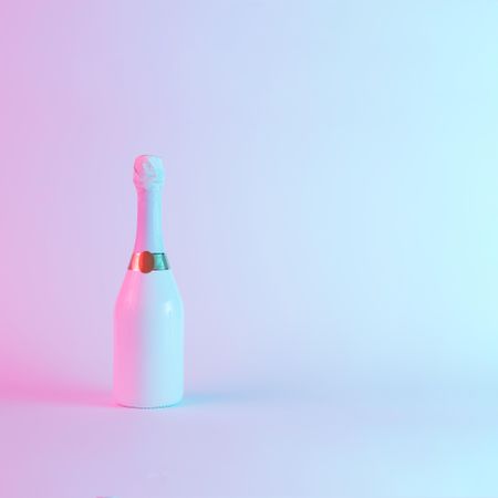 Champagne bottle with colorful ultraviolet holographic neon lights