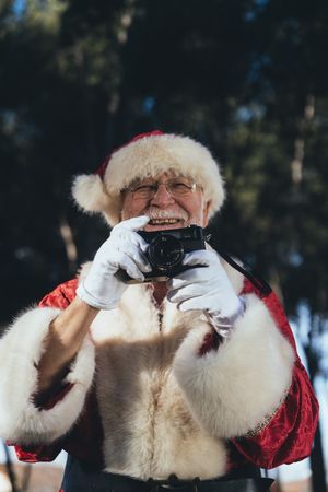Happy Santa Claus with camera