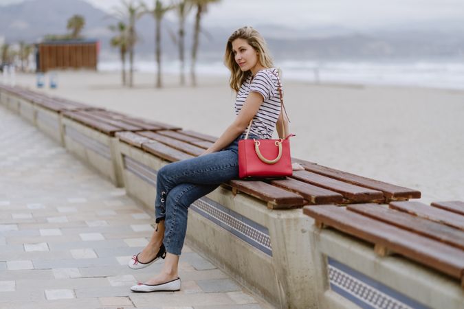 Young woman sitting on bench