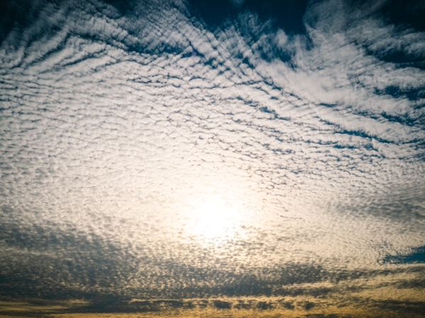 Picturesque cloudy sky at sundown