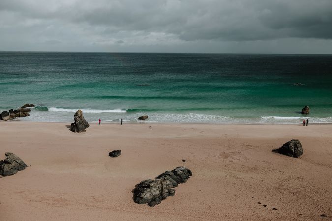 Sandy beach under overcast sky in Scotland