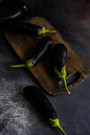 Eggplants on wooden board