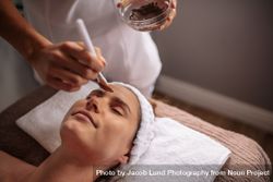 Woman receiving facial mask in spa beauty salon 5Q2BQm