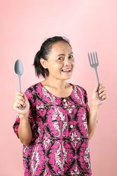 Indonesian Woman Holding Spoon and Fork