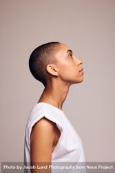Side view of a female in casuals with shaved head bem7Ab