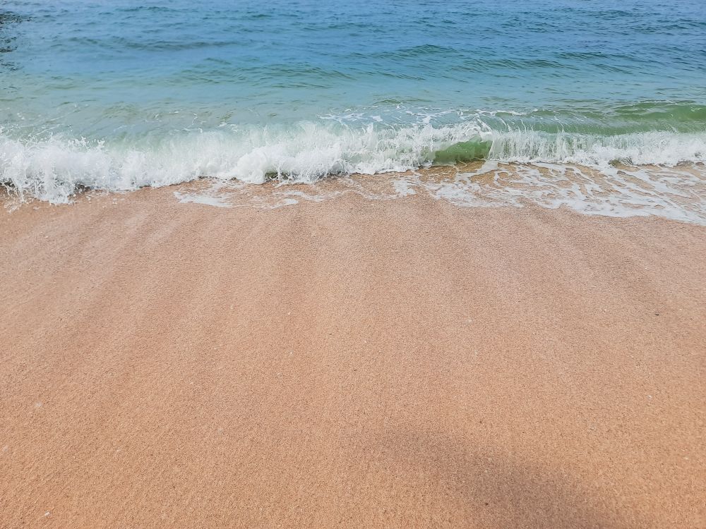 Clean Sandy Beach with Ocean Waves in Angso Duo Island