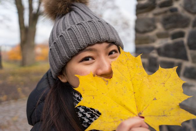 Cheerful young Asian female traveler enjoying sightseeing in Oslo