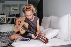 Child playing the guitar