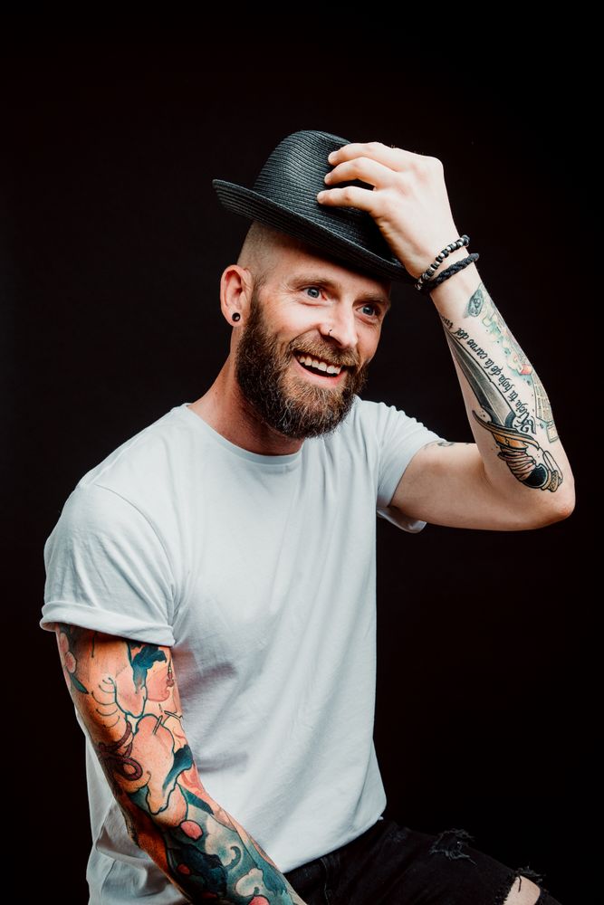 Smiling young guy in hat