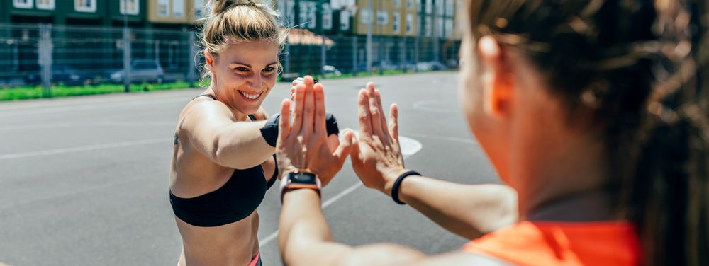 Sportswoman training boxing with her trainer