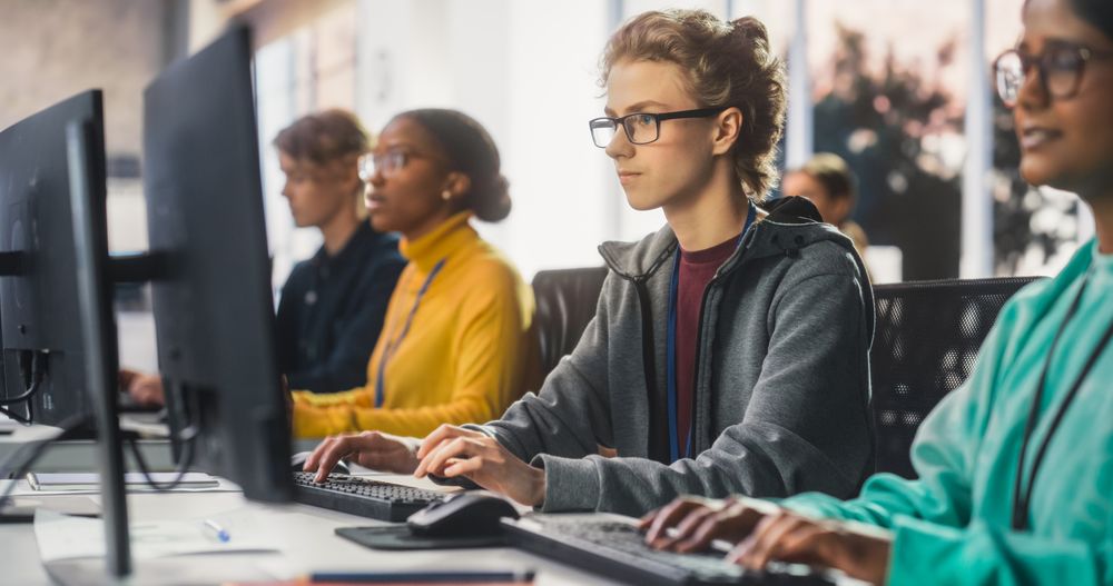 Young Female Scholar Studying in College with Diverse Multiethnic Classmates.