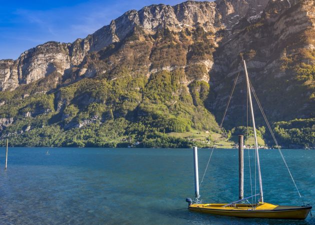 Boat with sails anchored on Walensee lake