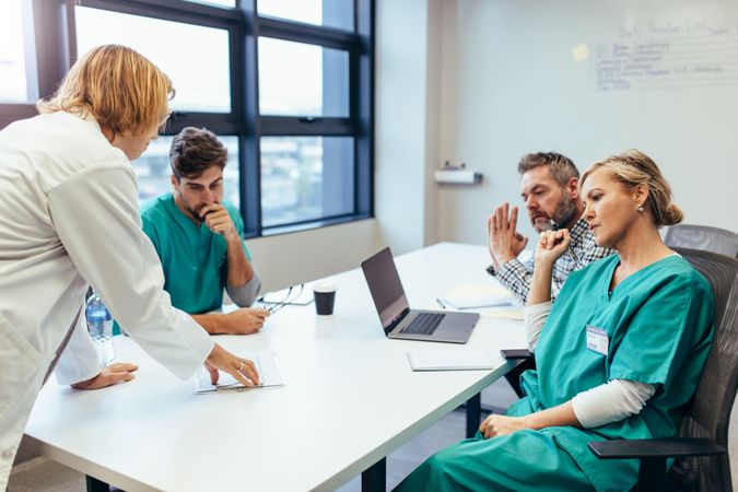 Group of medical professionals brainstorming in a meeting