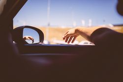 Passenger view from inside a car during a road trip