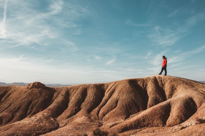 Tourist on sandy canyon hills