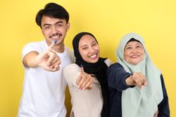 Three People Indonesian Family Showed Tinta Pemilu, Inked Finger