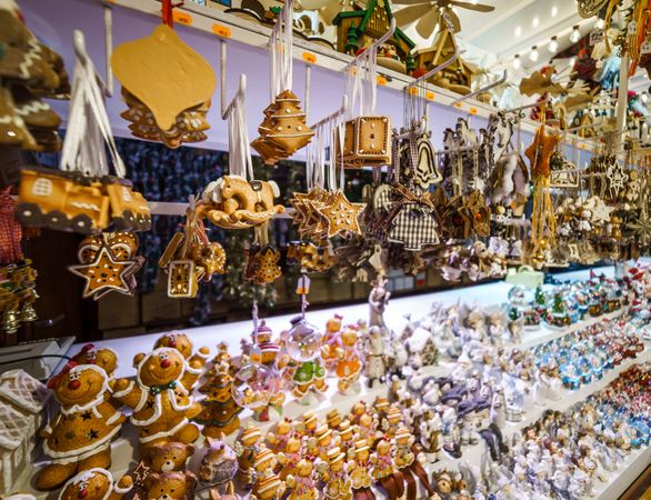 Traditional Christmas market with handmade souvenirs on shelves in shop