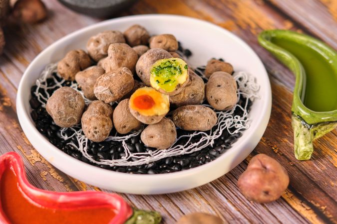 Potato dish near sauce bowls
