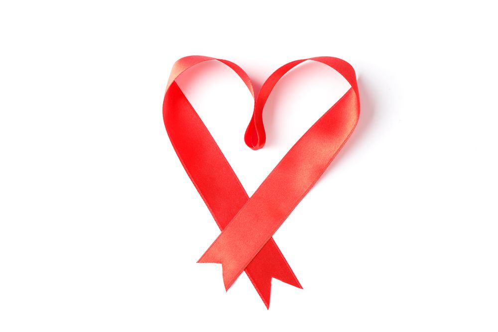 Red ribbon heart isolated on blank background