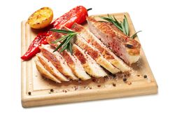 Board with chopped pork steak isolated on blank background