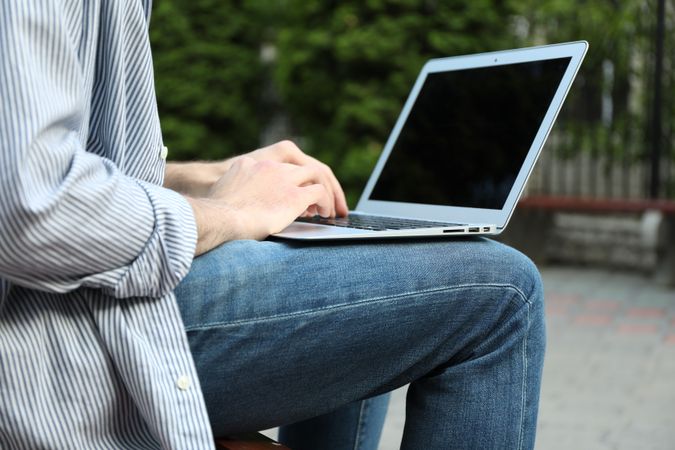 Young student working in a laptop outdoor. Study. University