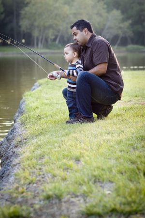 Happy Young Father and Son Fishing