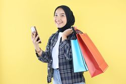 Asian Young Woman Happy Face after Online Shopping