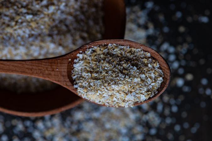 Close up of wooden spoon with oats