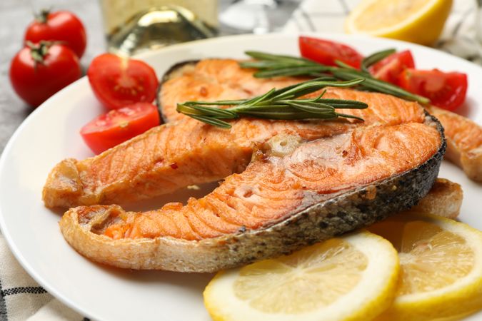 Composition with tasty grilled salmon, close up