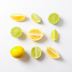 Flat lay composition with citrus on plain background, space for text