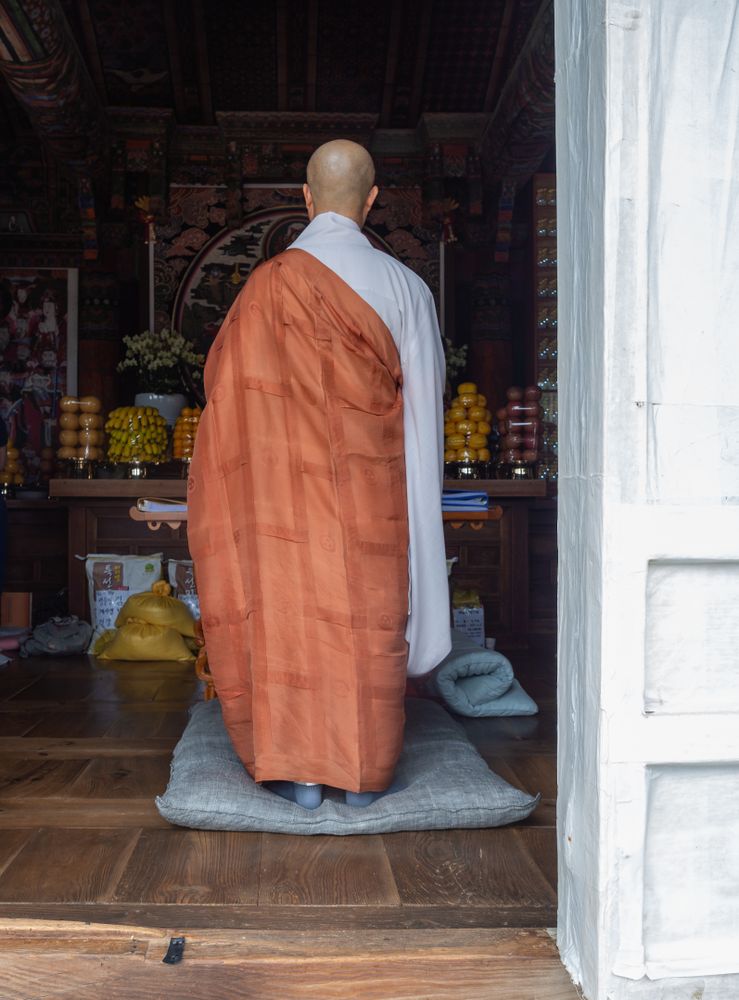 Busan, South Korea - August, 05 2017: Anonymous monk standing in shrine