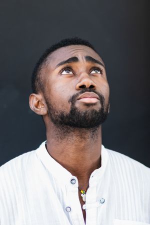 Black man in trendy clothes in city