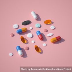 Pills and capsules on pink background with summer sun and sharp shadow 4ARyRb
