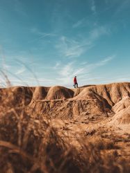 Tourist on sandy canyon hills