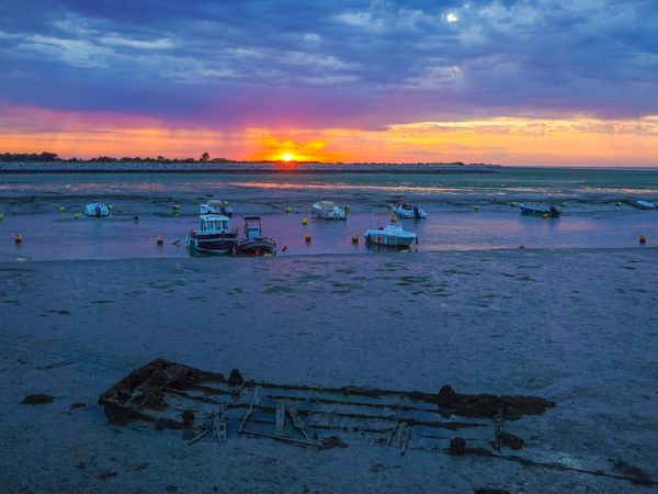 Wreck revealed at low tide and sunrise