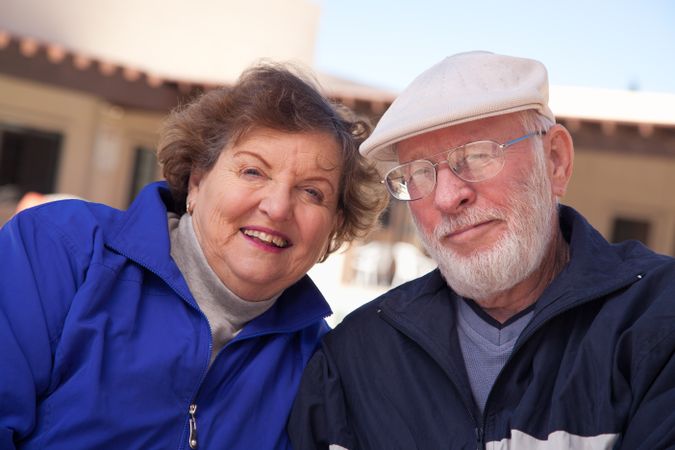 Happy Mature Adult Couple Bundled Up Outdoors