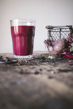 Beetroot and fresh smoothie on wooden table