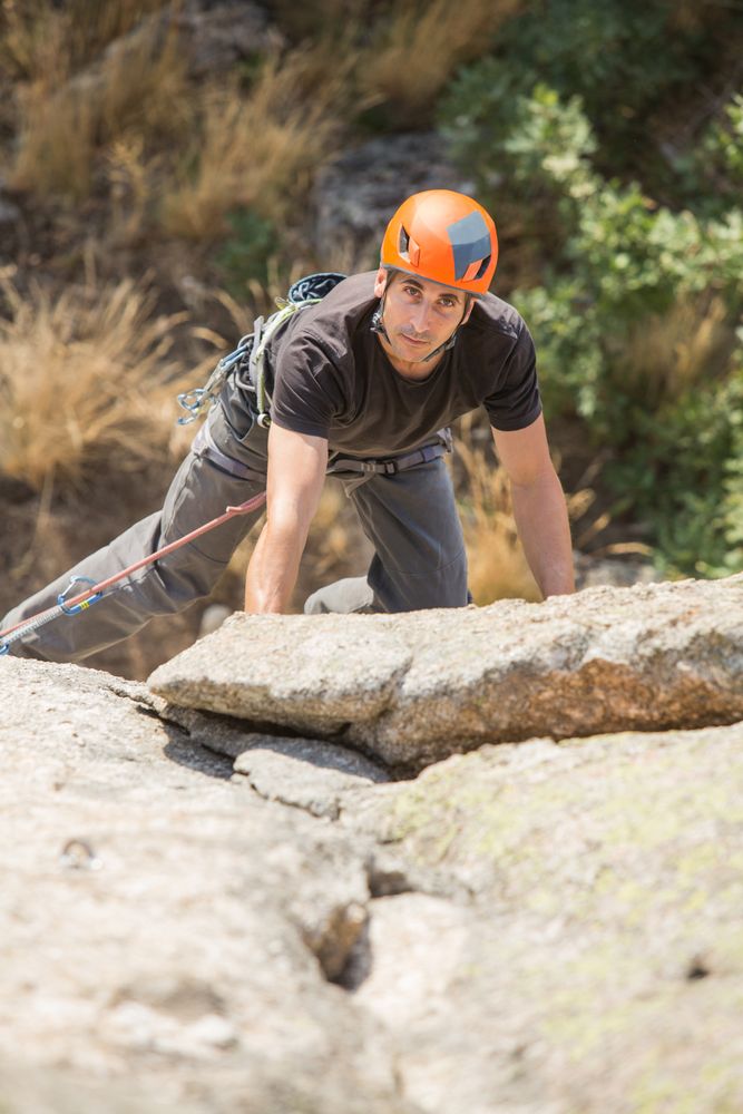 Man climbing a rock