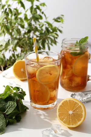 Cold tea with fresh oranges and mint leaves