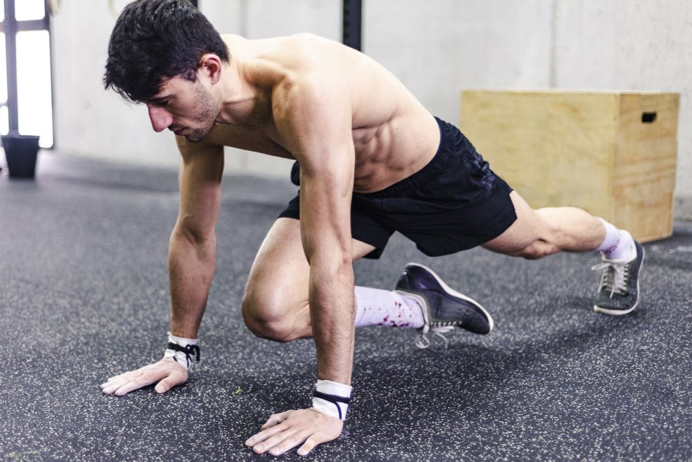 Man stretching in gym