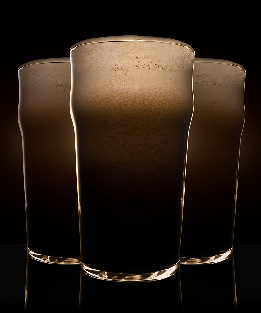 Glasses of beer with heavy dark foam