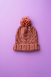 Knit beanie on purple background