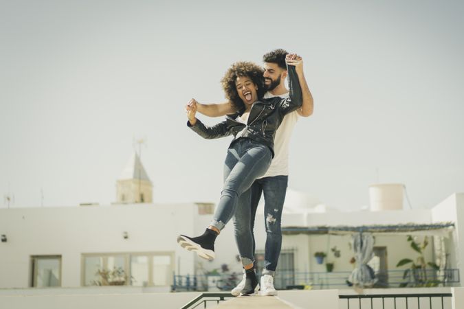 Young couple having fun on street