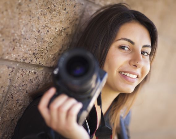 Young Adult Female Photographer Holding Camera