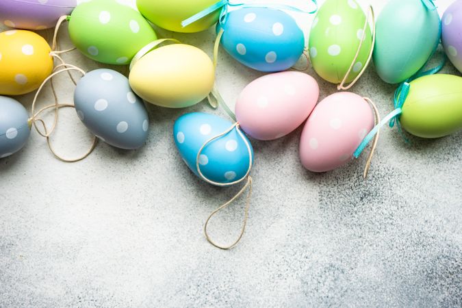 Easter festive card concept with pastel egg decorations on grey counter