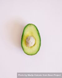 Flat lay of cut avocado on paper background 0WzDrb