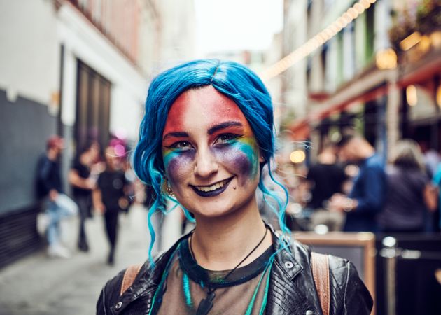 London, England, United Kingdom - July 7th, 2019: Portrait of woman with painted face in blue wig