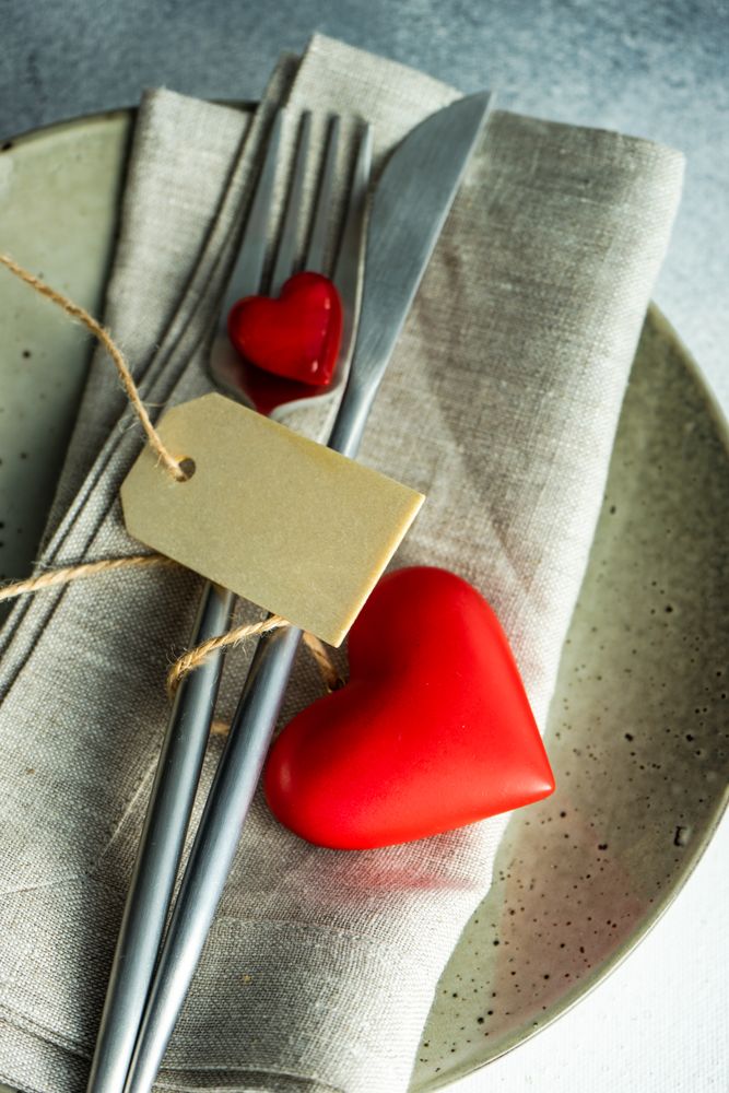 St. Valentine day card table setting with blank tag